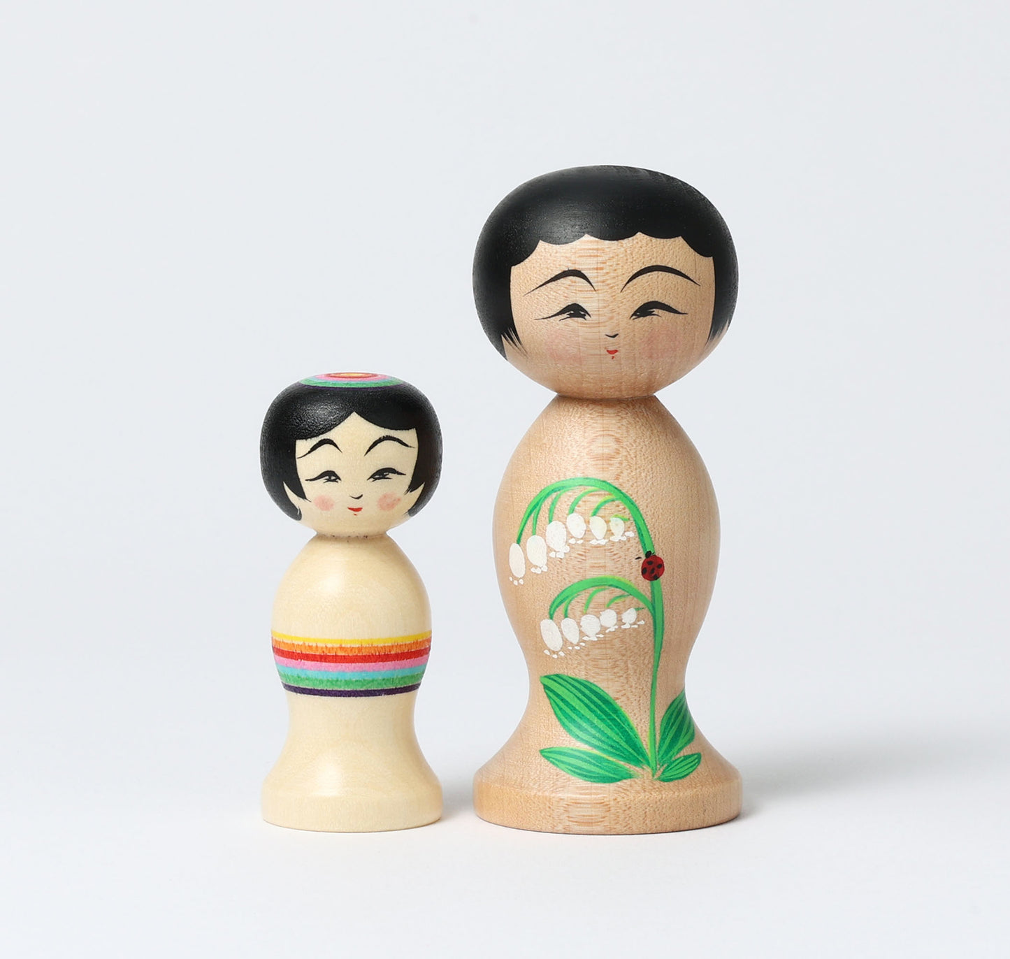 HIRAGA, Teruyuki 平賀輝幸工人 | set of 2 kokeshi dolls-lily of the valley and mini rainbow kokeshi dolls すずらんと虹のミニこけし |  Sakunami style 作並系 | 10.5cm in height