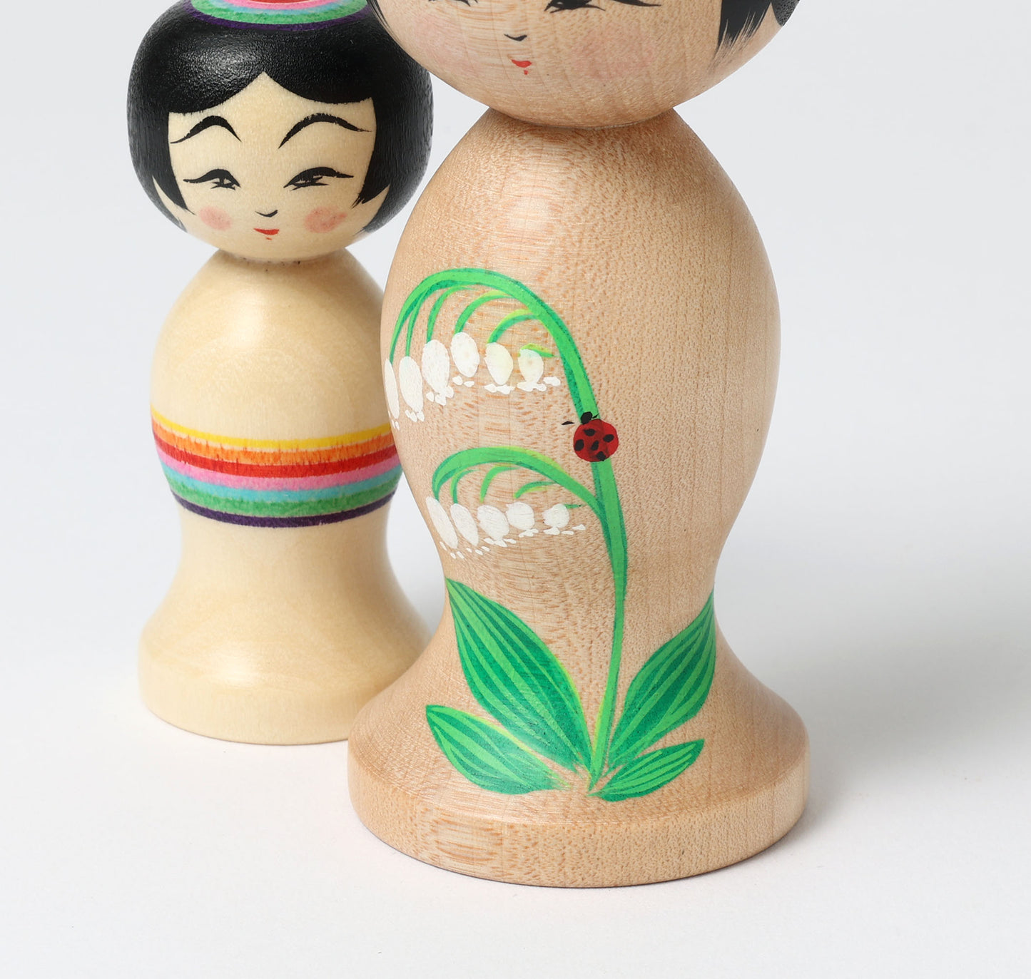 HIRAGA, Teruyuki 平賀輝幸工人 | set of 2 kokeshi dolls-lily of the valley and mini rainbow kokeshi dolls すずらんと虹のミニこけし |  Sakunami style 作並系 | 10.5cm in height