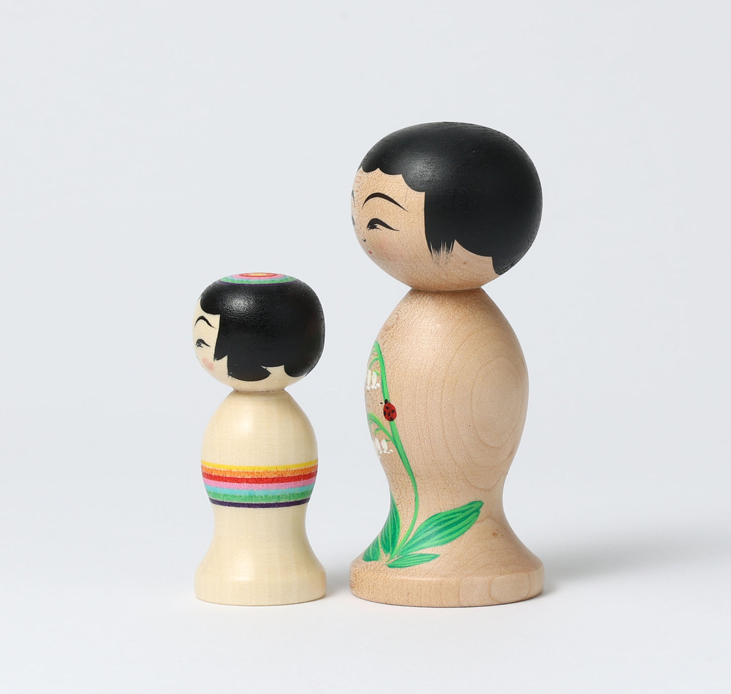 HIRAGA, Teruyuki 平賀輝幸工人 | set of 2 kokeshi dolls-lily of the valley and mini rainbow kokeshi dolls すずらんと虹のミニこけし |  Sakunami style 作並系 | 10.5cm in height