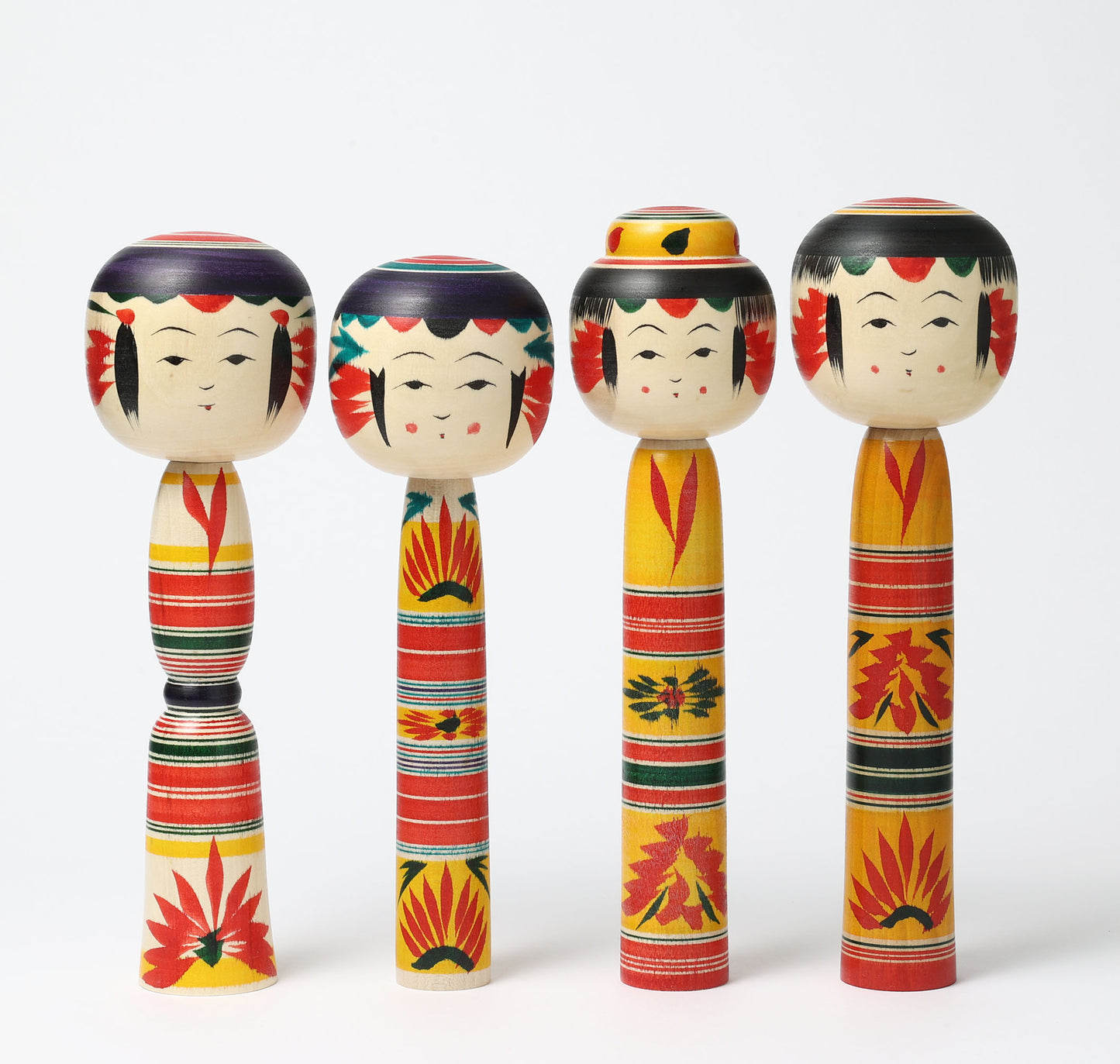 Four dento-traditional Yajiro style kokeshi dolls, by Atsushi Kimura.