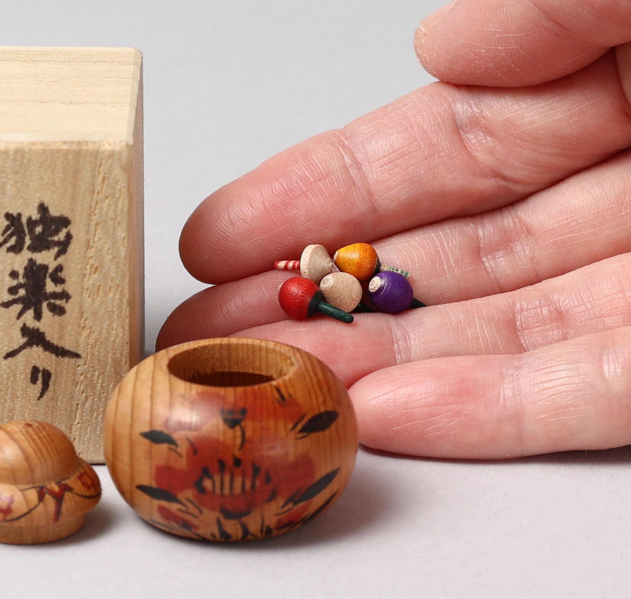Vintage ejiko kokeshi with spinning tops えじここけし, by